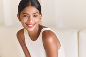 Close-up of a person showcasing a bright white smile after professional teeth whitening.